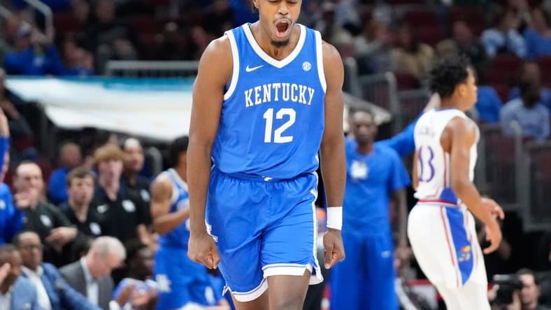 Nov 14, 2023; Chicago, Illinois, USA; Kentucky Wildcats guard Antonio Reeves (12) reacts after scoring against the Kansas Jayhawks during the second half at United Center. Mandatory Credit: David Banks-USA TODAY Sports