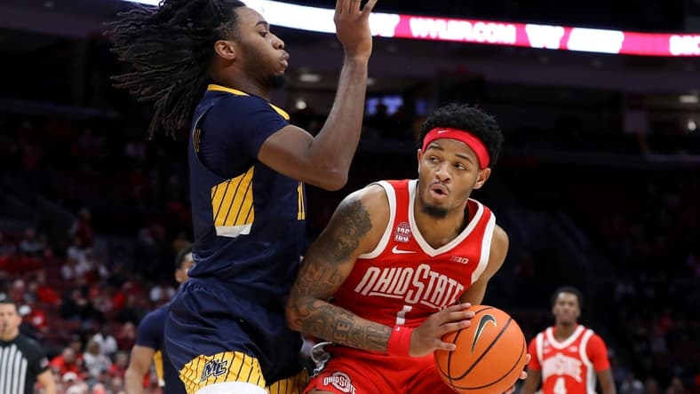 Nov 15, 2023; Columbus, Ohio, USA;  Ohio State Buckeyes guard Roddy Gayle Jr. (1) looks for space to dribble as Merrimack College Warriors forward Bryan Etumnu (11)defends during the second half at Value City Arena. Mandatory Credit: Joseph Maiorana-USA TODAY Sports