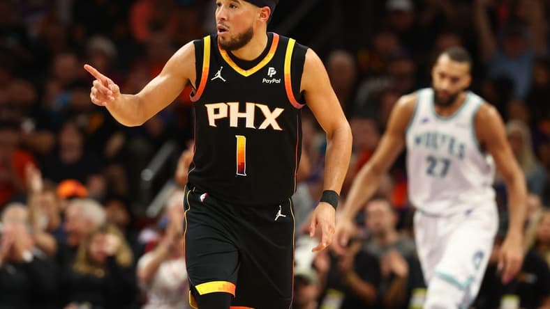 Nov 15, 2023; Phoenix, Arizona, USA; Phoenix Suns guard Devin Booker (1) reacts against the Minnesota Timberwolves in the second half at Footprint Center. Mandatory Credit: Mark J. Rebilas-USA TODAY Sports