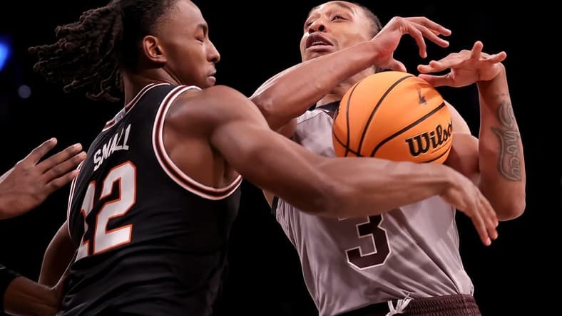 Nov 16, 2023; Brooklyn, New York, USA; Oklahoma State Cowboys guard Javon Small (12) strips the ball from St. Bonaventure Bonnies guard Mika Adams-Woods (3) during the first half at Barclays Center. Mandatory Credit: Brad Penner-USA TODAY Sports