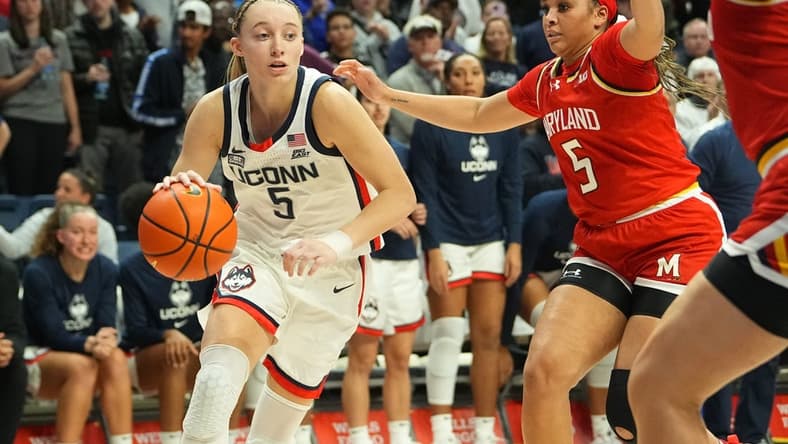 Nov 16, 2023; Storrs, Connecticut, USA; Connecticut Huskies guard Paige Bueckers (5) drives the ball toward the basket against Maryland Terrapins guard Brinae Alexander (5) during the second half at Harry A. Gampel Pavilion. Mandatory Credit: Gregory Fisher-USA TODAY Sports