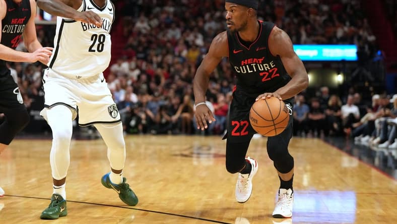 Nov 16, 2023; Miami, Florida, USA;  Miami Heat forward Jimmy Butler (22) drives to the basket as Brooklyn Nets forward Dorian Finney-Smith (28) defends in the first half at Kaseya Center. Mandatory Credit: Jim Rassol-USA TODAY Sports