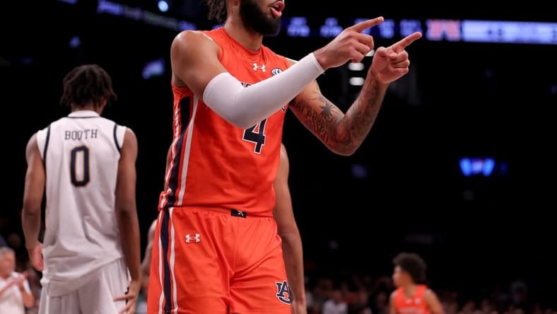 Nov 16, 2023; Brooklyn, New York, USA; Auburn Tigers forward Johni Broome (4) reacts during the second half against the Notre Dame Fighting Irish at Barclays Center. Mandatory Credit: Brad Penner-USA TODAY Sports