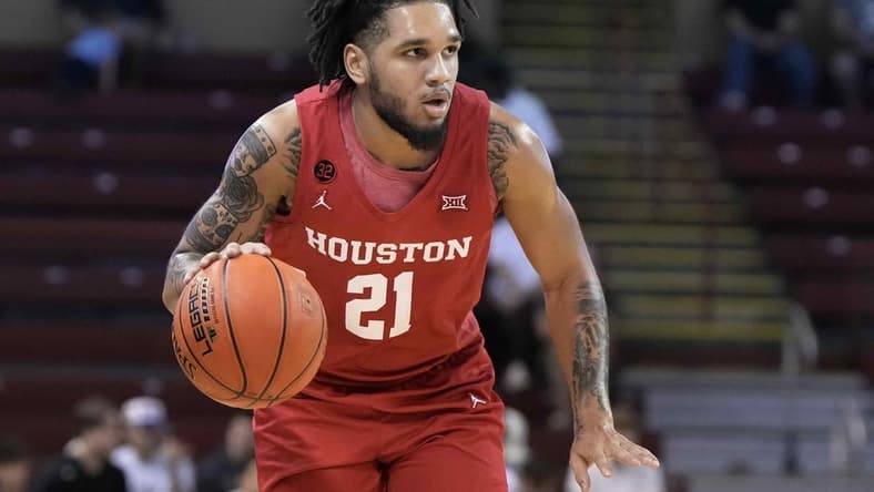 Nov 17, 2023; Charleston, SC, USA; Houston Cougars guard Emanuel Sharp (21) brings the ball up court in the first half against the Utah Utes at TD Arena. Mandatory Credit: David Yeazell-USA TODAY Sports