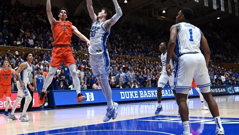 Nov 17, 2023; Durham, North Carolina, USA; Bucknell Bison forward Brady Muller (3) shoots over Duke Blue Devils center Kyle Filipowski(30) during the first half at Cameron Indoor Stadium. Mandatory Credit: Rob Kinnan-USA TODAY Sports