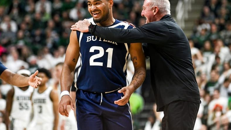 Butler's Pierre Brooks II, left, and head coach Thad Matta laugh after Brooks was called for a technical foul after celebrating his dunk against Michigan State during the first half on Friday, Nov. 17, 2023, in East Lansing.