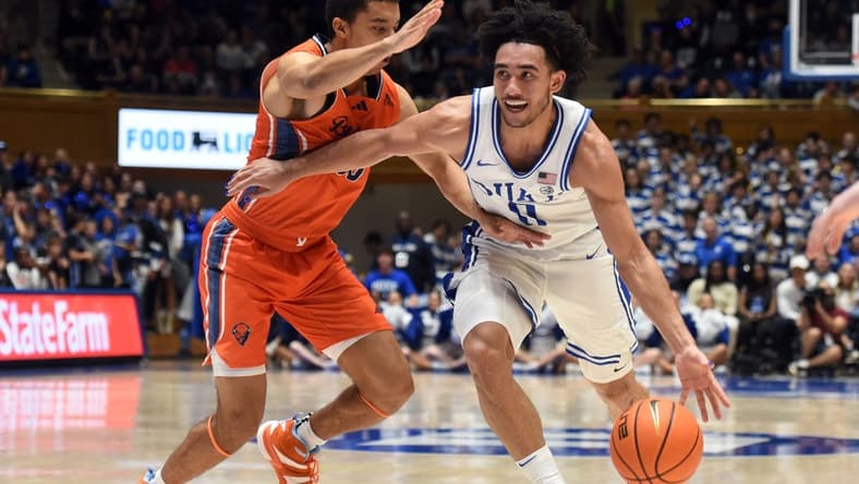 Nov 17, 2023; Durham, North Carolina, USA; Duke Blue Devils guard Jared McCain (0) drives to the basket as Bucknell Bison guard Brandon McCreesh (10) defends during the second half at Cameron Indoor Stadium. Mandatory Credit: Rob Kinnan-USA TODAY Sports