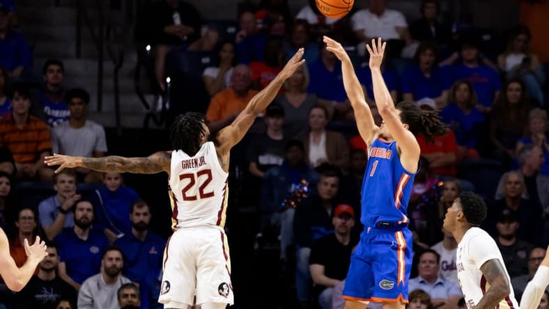 Nov 17, 2023; Gainesville, Florida, USA; Florida Gators guard Walter Clayton Jr. (1) shoots over Florida State Seminoles guard Darin Green Jr. (22) during the first half at Exactech Arena at the Stephen C. O'Connell Center. Mandatory Credit: Matt Pendleton-USA TODAY Sports
