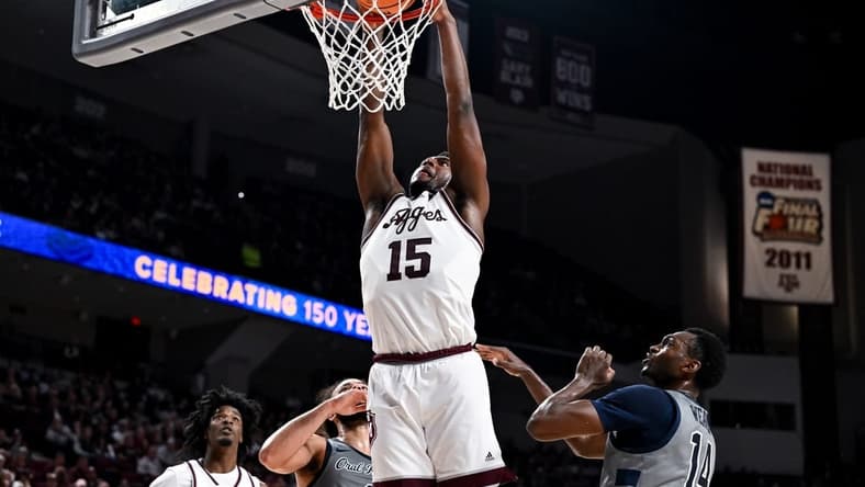 Nov 17, 2023; College Station, Texas, USA;  Texas A&M Aggies forward Henry Coleman III (15) dunks the ball during the first half against the Oral Roberts Golden Eagles at Reed Arena. Mandatory Credit: Maria Lysaker-USA TODAY Sports