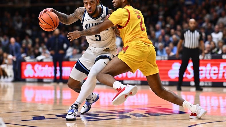Nov 17, 2023; Villanova, Pennsylvania, USA; Villanova Wildcats guard Justin Moore (5) drives against Maryland Terrapins guard Jahari Long (2) in the first half at William B. Finneran Pavilion. Mandatory Credit: Kyle Ross-USA TODAY Sports