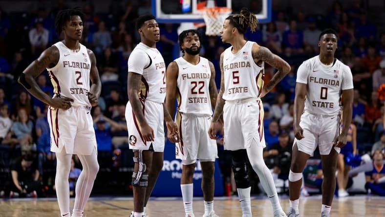 Nov 17, 2023; Gainesville, Florida, USA; Florida State Seminoles forward Jamir Watkins (2), Florida State Seminoles guard Cam'Ron Fletcher (21), Florida State Seminoles guard Darin Green Jr. (22), Florida State Seminoles forward De'Ante Green (5) and Florida State Seminoles guard Chandler Jackson (0) look on during the second half against the Florida Gators at Exactech Arena at the Stephen C. O'Connell Center. Mandatory Credit: Matt Pendleton-USA TODAY Sports