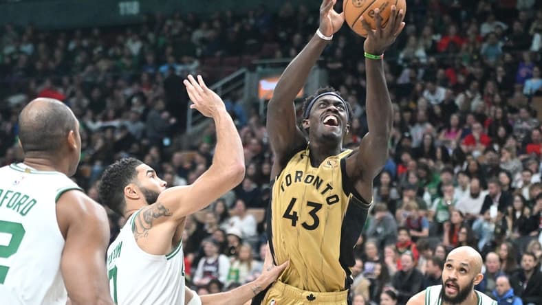 Nov 17, 2023; Toronto, Ontario, CAN;   Toronto Raptors forward Pascal Siakam (43) shoots the ball over Boston Celtics forward Jayson Tatum (0) in the second half at Scotiabank Arena. Mandatory Credit: Dan Hamilton-USA TODAY Sports