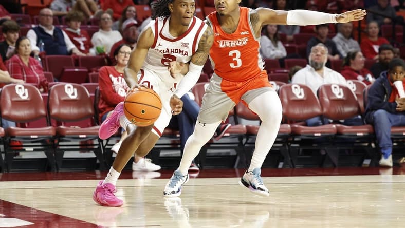 Nov 17, 2023; Norman, Oklahoma, USA; Oklahoma Sooners guard Javian McCollum (2) drives around UT Rio Grande Valley Vaqueros guard DeAnthony Tipler Jr. (3) during the second half at Lloyd Noble Center. Mandatory Credit: Alonzo Adams-USA TODAY Sports