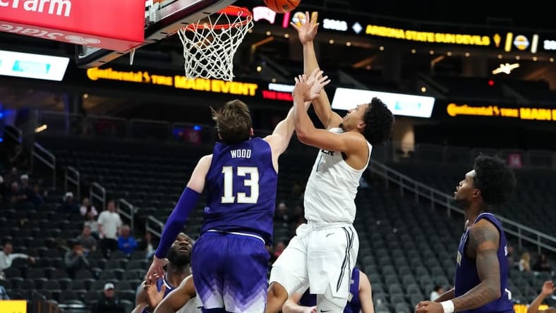 Nov 17, 2023; Las Vegas, Nevada, USA; Xavier Musketeers guard Desmond Claude (1) shoots against Washington Huskies forward Moses Wood (13) during the second half at T-Mobile Arena. Mandatory Credit: Stephen R. Sylvanie-USA TODAY Sports