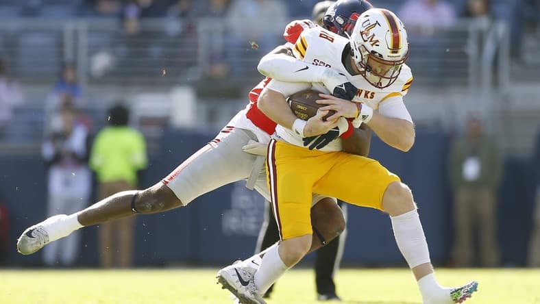 Nov 18, 2023; Oxford, Mississippi, USA; Louisiana Monroe Warhawks quarterback Jiya Wright (18) runs the ball as Mississippi Rebels defensive back Ladarius Tennison (13) makes the tackle during the first half at Vaught-Hemingway Stadium. Mandatory Credit: Petre Thomas-USA TODAY Sports