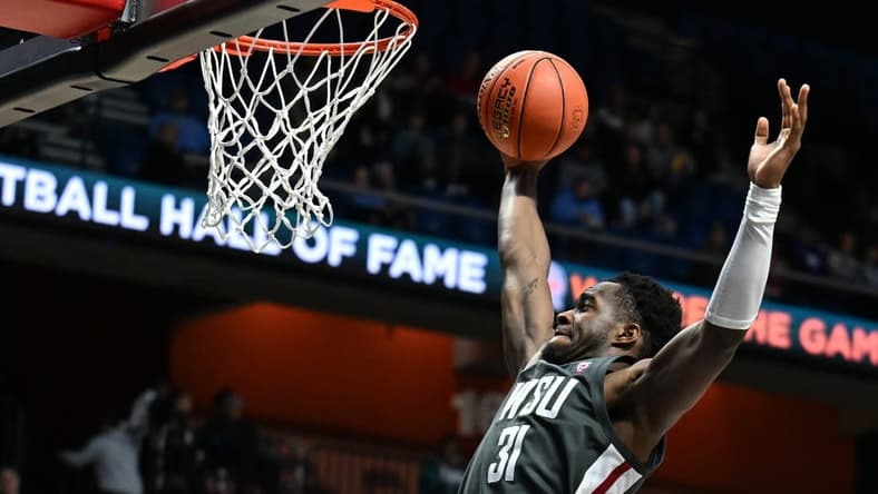 Nov 18, 2023; Uncasville, CT, USA; Washington State Cougars guard Kymany Houinsou (31) rebounds the ball during the second half against Mississippi State Bulldogs at Mohegan Sun Arena. Mandatory Credit: Mark Smith-USA TODAY Sports
