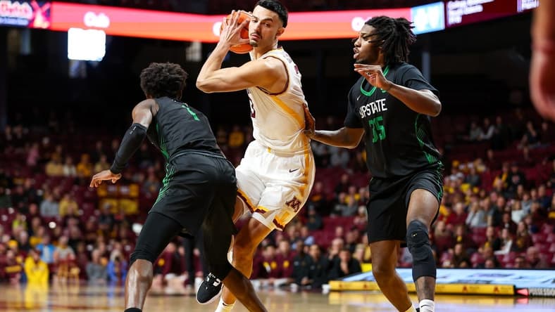 Nov 18, 2023; Minneapolis, Minnesota, USA; Minnesota Golden Gophers forward Dawson Garcia (3) drives to the basket while USC Upstate Spartans forward Ahmir Langlais (35) and guard Nick Alves (1) defends during the first half at Williams Arena. Mandatory Credit: Matt Krohn-USA TODAY Sports