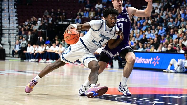 Nov 18, 2023; Uncasville, Connecticut, USA; Rhode Island Rams guard Jaden House (2) dribbles the ball around Northwestern Wildcats guard Brooks Barnhizer (13) during the first half at Mohegan Sun Arena. Mandatory Credit: Mark Smith-USA TODAY Sports