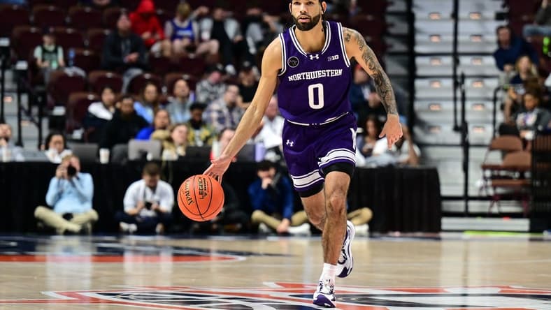 Nov 18, 2023; Uncasville, Connecticut, USA; Northwestern Wildcats guard Boo Buie (0) dribbles the ball against the Rhode Island Rams during the second half at Mohegan Sun Arena. Mandatory Credit: Mark Smith-USA TODAY Sports