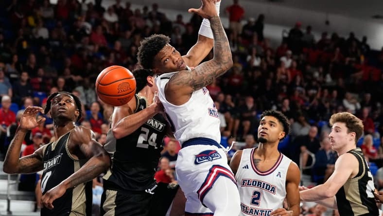 Nov 18, 2023; Boca Raton, Florida, USA; Florida Atlantic Owls guard Alijah Martin (15) attempts to grab a rebound against the Bryant University Bulldogs during the first half at Eleanor R. Baldwin Arena. Mandatory Credit: Rich Storry-USA TODAY Sports