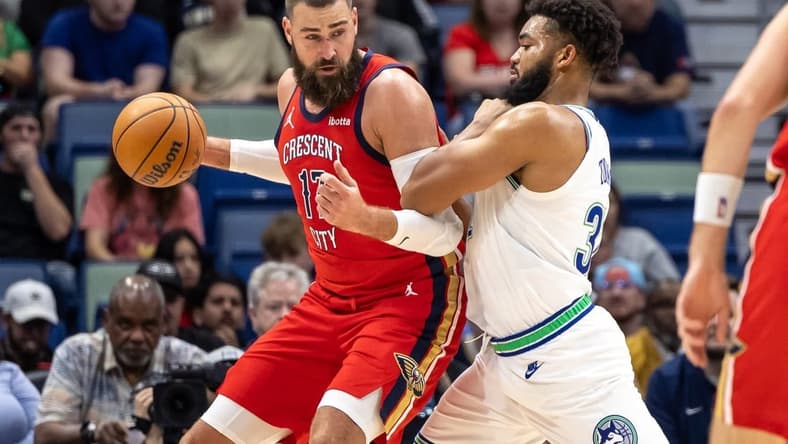 Nov 18, 2023; New Orleans, Louisiana, USA; New Orleans Pelicans center Jonas Valanciunas (17) fights for position against Minnesota Timberwolves center Karl-Anthony Towns (32) during the first half at the Smoothie King Center. Mandatory Credit: Stephen Lew-USA TODAY Sports