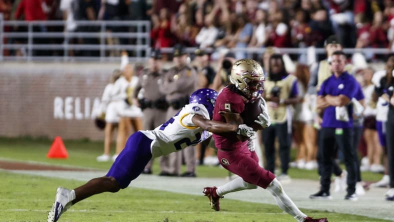 Nov 18, 2023; Tallahassee, Florida, USA; Florida State Seminoles running back Lawrance Toafili (9) tackled by North Alabama Lions defensive back Cameron Jamar (24) during the second quarter at Doak S. Campbell Stadium. Mandatory Credit: Morgan Tencza-USA TODAY Sports
