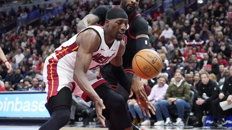 Nov 18, 2023; Chicago, Illinois, USA; Chicago Bulls center Andre Drummond (3) defends Miami Heat center Bam Adebayo (13) during the first half at United Center. Mandatory Credit: David Banks-USA TODAY Sports