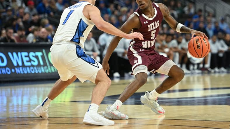 Nov 18, 2023; Omaha, Nebraska, USA; Texas Southern Tigers guard Jaylen Wysinger (5) dribbles against Creighton Bluejays guard Steven Ashworth (1) in the first half at CHI Health Center Omaha. Mandatory Credit: Steven Branscombe-USA TODAY Sports