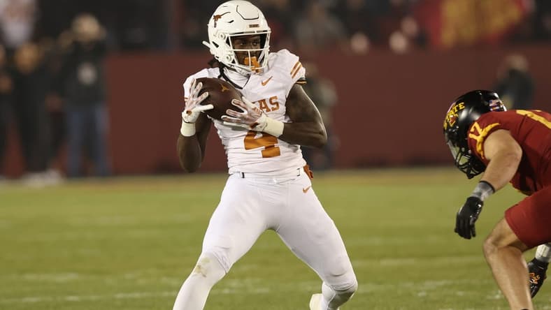 Nov 18, 2023; Ames, Iowa, USA; Texas Longhorns running back CJ Baxter (4) catches a pass against the Iowa State Cyclones at Jack Trice Stadium. Mandatory Credit: Reese Strickland-USA TODAY Sports
