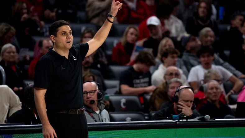 Cincinnati Bearcats head coach Wes Miller speaks to his players in the first half of the NCAA basketball game between the Cincinnati Bearcats and the Northern Kentucky Norse at Fifth Third Arena in Cincinnati on Sunday, Nov. 19, 2023.