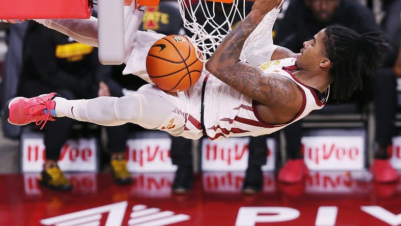 Iowa State Cyclones guard Keshon Gilbert (10) hangs in the basket after a dunk against Grambling State during the first half in the NCAA men's basketball at Hilton Coliseum on Sunday, Nov. 19, 2023, in Ames, Iowa.