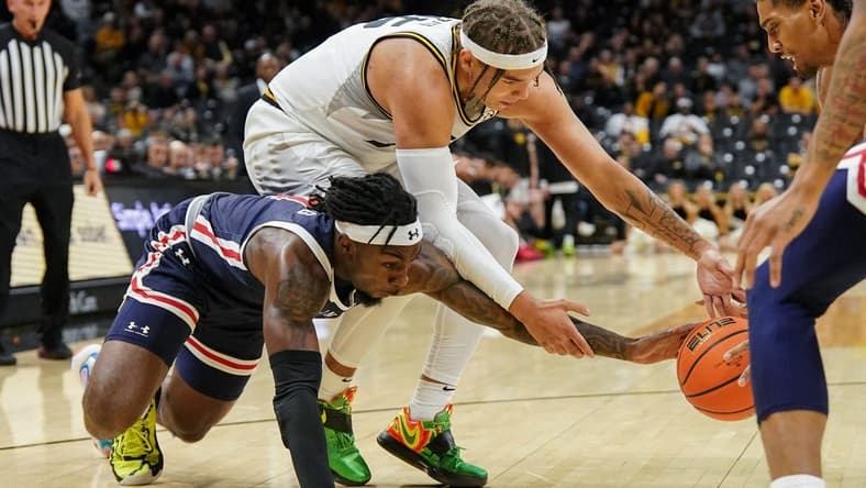 Nov 19, 2023; Columbia, Missouri, USA; Missouri Tigers forward Noah Carter (35) and Jackson State Tigers forward Jordan O'Neal (23) and guard Chase Adams (10) fight for a loose ball during the first half at Mizzou Arena. Mandatory Credit: Denny Medley-USA TODAY Sports