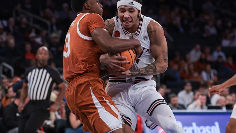 Nov 19, 2023; New York, New York, USA; Texas Longhorns guard Max Abmas (3) ties up Louisville Cardinals guard Tre White (22) during the second half at Madison Square Garden. Mandatory Credit: Vincent Carchietta-USA TODAY Sports
