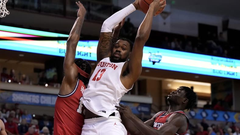 Nov 19, 2023; Charleston, SC, USA; Houston Cougars forward J'Wan Roberts (13) gets a rebound in the first half against the Dayton Flyers at TD Arena. Mandatory Credit: David Yeazell-USA TODAY Sports