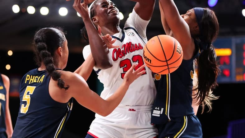 Ole Miss Rebels center Rita Igbokwe (32) goes up against Michigan Wolverines guard Laila Phelia (5) during the first half at Imperial Arena. Mandatory Credit: Kevin Jairaj-USA TODAY Sports