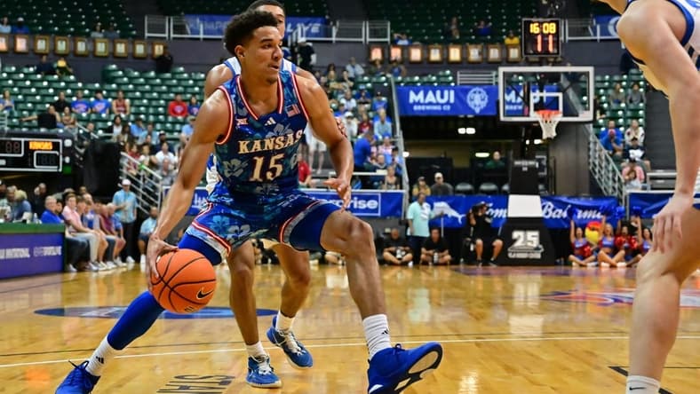 Nov 20, 2023; Honolulu, Hawaii, USA;  Kansas Jayhawks guard Kevin McCullar Jr. (15) drives to the basket against Chaminade Silverswords forward Scott Ator (24) during the first period at SimpliFi Arena at Stan Sheriff Center. Mandatory Credit: Steven Erler-USA TODAY Sports