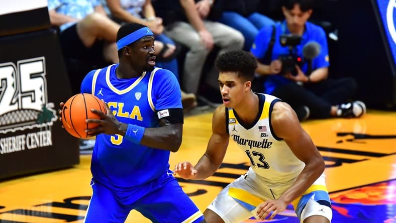 Nov 20, 2023; Honolulu, Hawaii, USA;  UCLA Bruins forward Adem Bona (3) is defended by Marquette Golden Eagles forward Oso Ighodaro (13) during the second period at SimpliFi Arena at Stan Sheriff Center. Mandatory Credit: Steven Erler-USA TODAY Sports