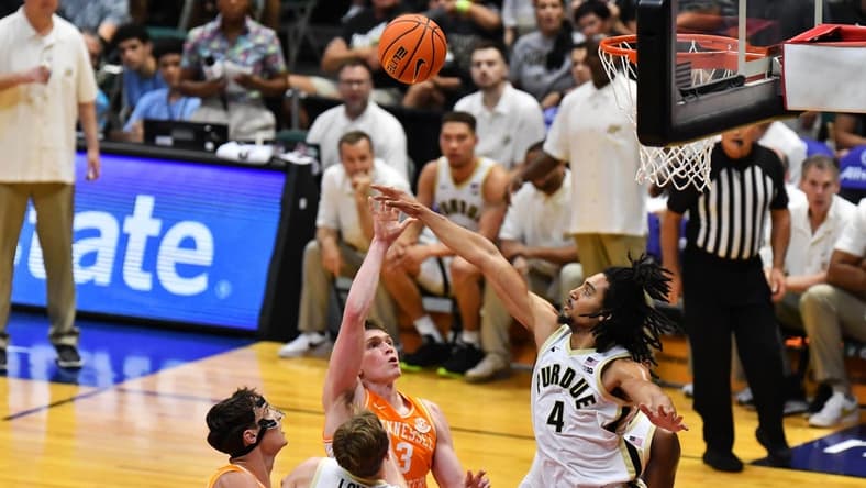 Nov 21, 2023; Honolulu, HI, USA; Tennessee Volunteers guard Dalton Knecht (3) attempts a shot defended by Purdue Boilermakers forward Trey Kaufman-Renn (4) during the first period at SimpliFi Arena at Stan Sheriff Center. Mandatory Credit: Steven Erler-USA TODAY Sports
