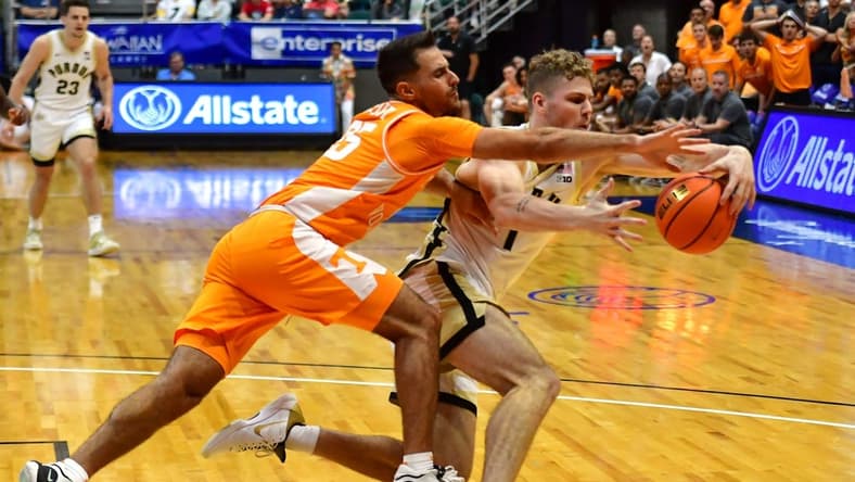 Nov 21, 2023; Honolulu, HI, USA; Tennessee Volunteers guard Santiago Vescovi (25) and Purdue Boilermakers forward Caleb Furst (1) fight for the ball during the second period at SimpliFi Arena at Stan Sheriff Center. Mandatory Credit: Steven Erler-USA TODAY Sports