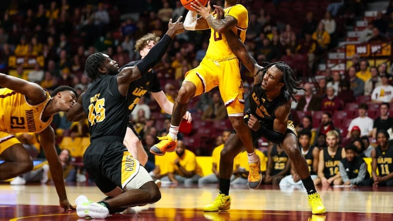 Nov 21, 2023; Minneapolis, Minnesota, USA; Arkansas-Pine Bluff Golden Lions guard Rashad Williams (5) fouls Minnesota Golden Gophers guard Elijah Hawkins (0) during the first half at Williams Arena. Mandatory Credit: Matt Krohn-USA TODAY Sports