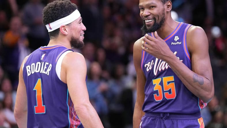 Nov 21, 2023; Phoenix, Arizona, USA; Phoenix Suns guard Devin Booker (1) and Phoenix Suns forward Kevin Durant (35) look on against the Portland Trail Blazers during the second half at Footprint Center. Mandatory Credit: Joe Camporeale-USA TODAY Sports
