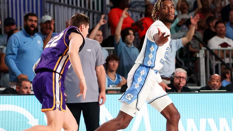 Nov 22, 2023; Paradise Island, BAHAMAS;  North Carolina Tar Heels forward Jae'Lyn Withers (24) reacts after scoring  over Northern Iowa Panthers forward Kyle Pock (22) during the first half at Imperial Arena. Mandatory Credit: Kevin Jairaj-USA TODAY Sports