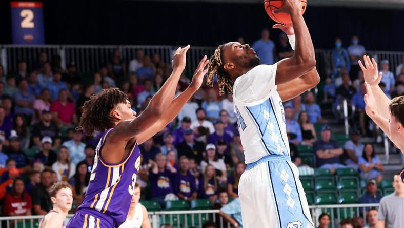 Nov 22, 2023; Paradise Island, BAHAMAS;  North Carolina Tar Heels forward Jae'Lyn Withers (24) scores as Northern Iowa Panthers guard Tytan Anderson (32) defends during the first half at Imperial Arena. Mandatory Credit: Kevin Jairaj-USA TODAY Sports