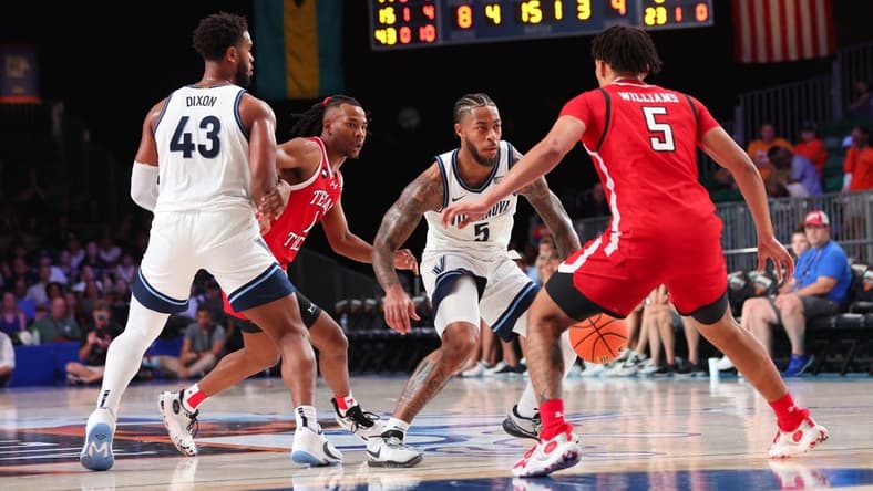 Nov 22, 2023; Paradise Island, BAHAMAS;  Villanova Wildcats guard Justin Moore (5) controls the ball as Texas Tech Red Raiders guard Darrion Williams (5) defends during the first half at Imperial Arena. Mandatory Credit: Kevin Jairaj-USA TODAY Sports