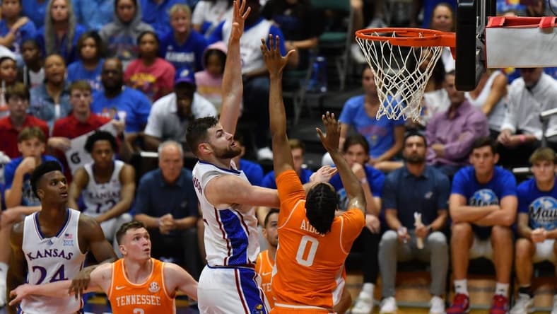 Nov 22, 2023; Honolulu, HI, USA;  Kansas Jayhawks center Hunter Dickinson (1) shoots the ball while defended by Tennessee Volunteers forward Jonas Aidoo (0) during the second half at SimpliFi Arena at Stan Sheriff Center. Mandatory Credit: Steven Erler-USA TODAY Sports