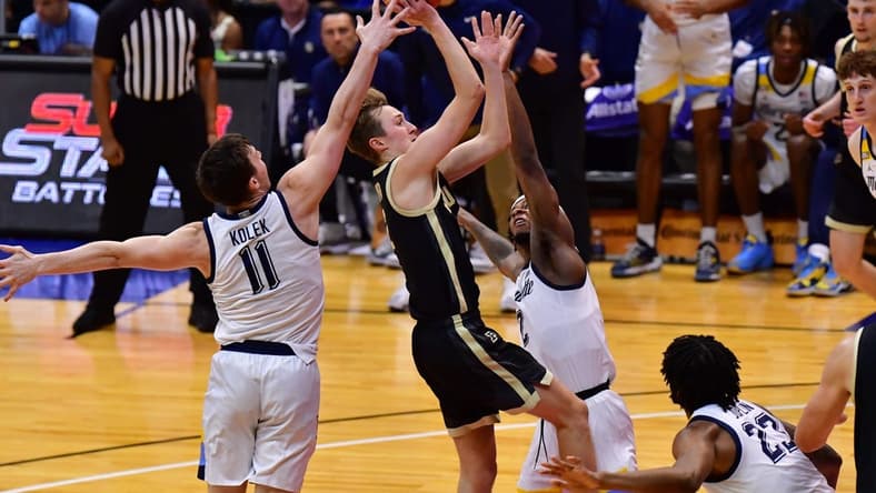 Nov 22, 2023; Honolulu, HI, USA; Purdue Boilermakers guard Fletcher Loyer (2) shoots the ball while defended by Marquette Golden Eagles guard Tyler Kolek (11) and guard Chase Ross (2) during the first period at SimpliFi Arena at Stan Sheriff Center. Mandatory Credit: Steven Erler-USA TODAY Sports