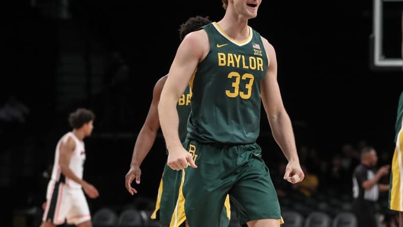 Nov 22, 2023; Brooklyn, NY, USA; Baylor Bears forward Caleb Lohner (33) celebrates after the Oregon State Beavers call a timeout in the first half at Barclay Center. Mandatory Credit: Wendell Cruz-USA TODAY Sports