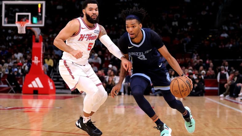 Nov 22, 2023; Houston, Texas, USA; Memphis Grizzlies forward Ziaire Williams (8) handles the ball against Houston Rockets guard Fred VanVleet (5) during the first quarter at Toyota Center. Mandatory Credit: Erik Williams-USA TODAY Sports