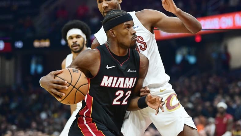 Nov 22, 2023; Cleveland, Ohio, USA; Miami Heat forward Jimmy Butler (22) drives to the basket against Cleveland Cavaliers forward Evan Mobley (4) during the first quarter at Rocket Mortgage FieldHouse. Mandatory Credit: Ken Blaze-USA TODAY Sports