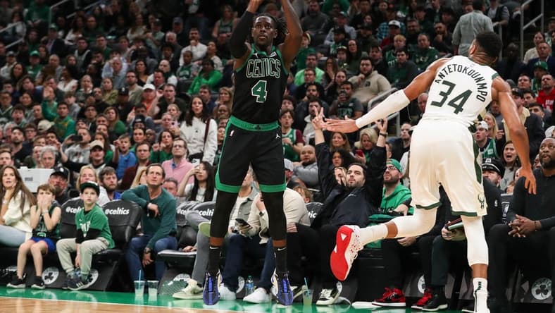 Nov 22, 2023; Boston, Massachusetts, USA; Boston Celtics guard Jrue Holiday (4) shoots during the first half against the Milwaukee Bucks at TD Garden. Mandatory Credit: Paul Rutherford-USA TODAY Sports
